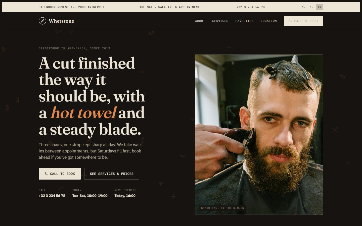 Screenshot of the live Whetstone Barbershop website, showing a barber giving a client a haircut
